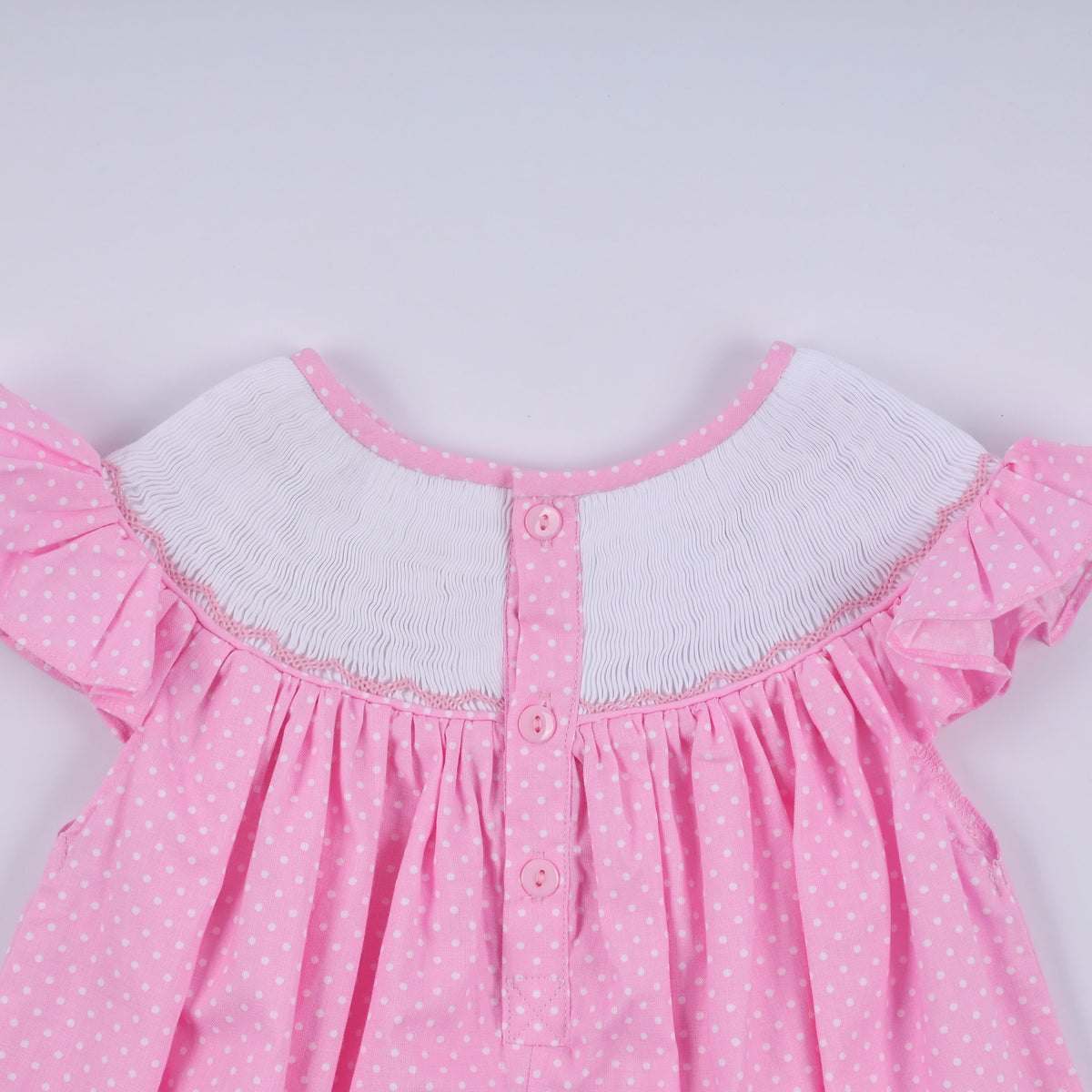 Pink character hand smocked dot ruffle dress