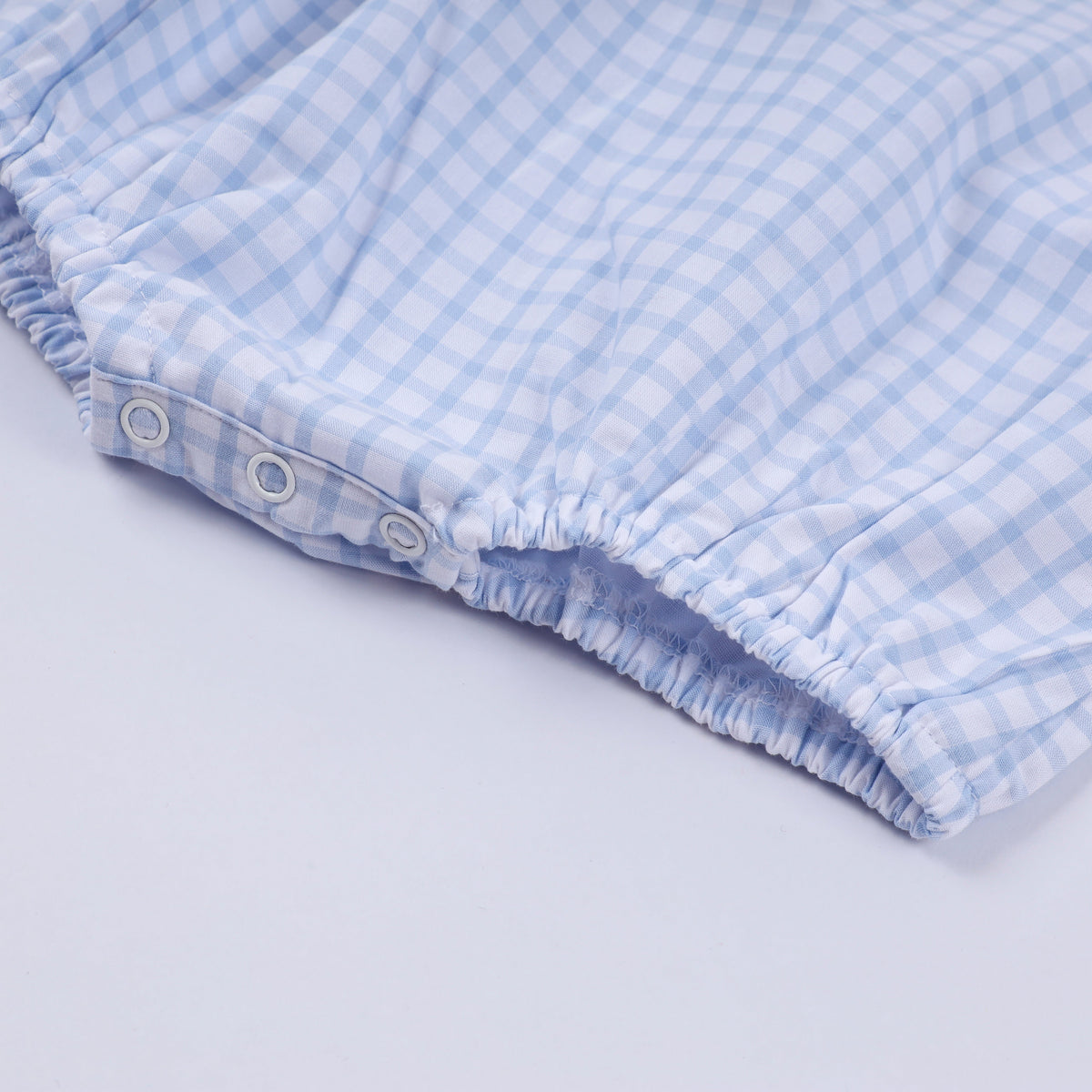 Blue character hand smocked gingham bubble